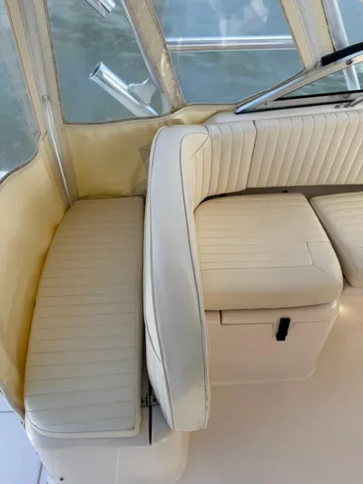  Yacht Photos Pics 2007 Grady-White Express 330 boat interior with cream-colored seating and clear windows.