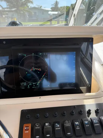  Yacht Photos Pics Control panel of a 2007 Grady-White Express 330 boat with Garmin navigation display.