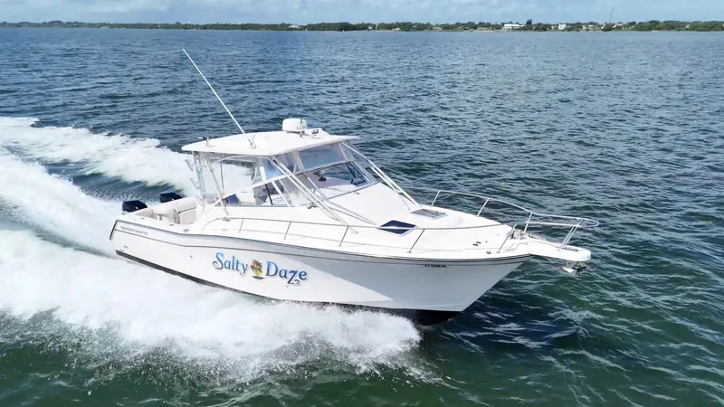  Yacht Photos Pics 2007 Grady-White Express 330 boat cruising on open water, named "Salty Daze".