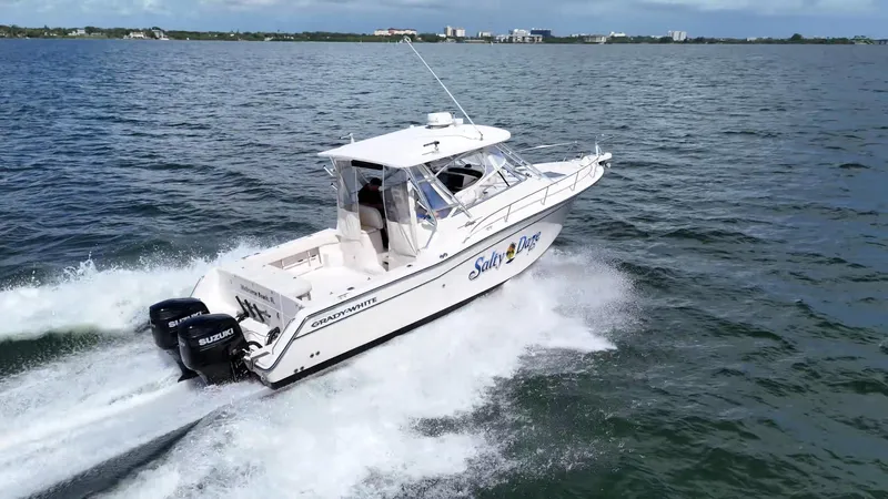  Yacht Photos Pics 2007 Grady-White Express 330 boat cruising on open water with dual Suzuki engines.