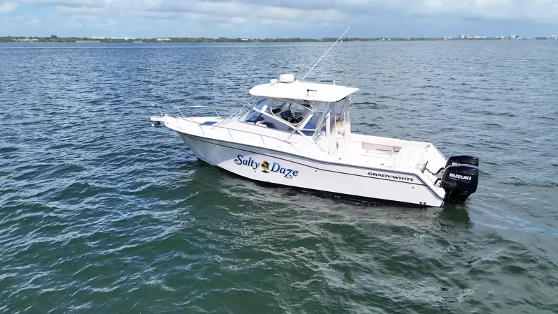  Yacht Photos Pics 2007 Grady-White Express 330 boat on open water, featuring Suzuki outboard engine.