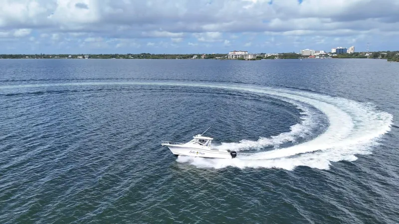 Yacht Photos Pics 2007 Grady-White Express 330 making a sharp turn on a calm lake.