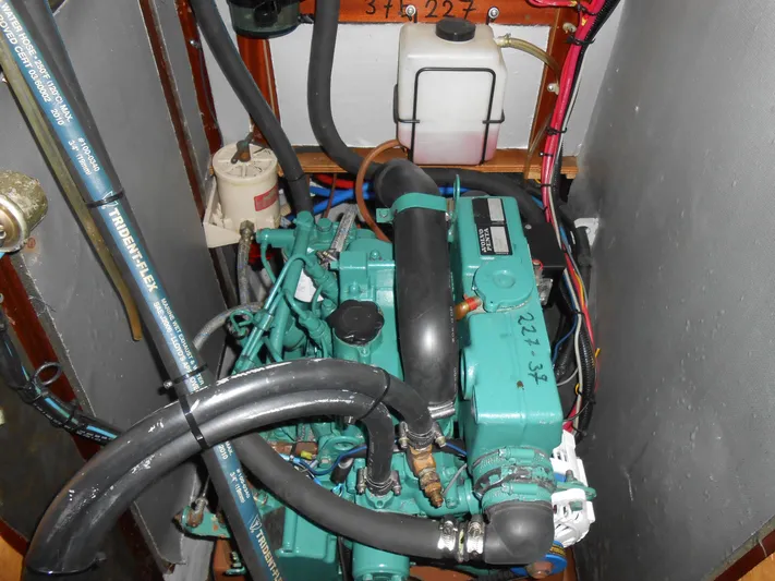 Pilitak Yacht Photos Pics Engine compartment of a 2001 Bavaria 37 sailboat, featuring a well-maintained marine engine.