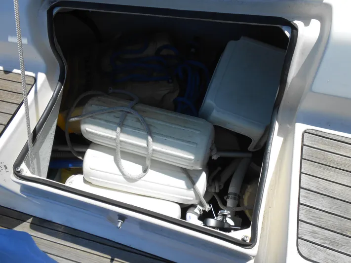 Pilitak Yacht Photos Pics Storage compartment on a 2001 Bavaria 37 yacht, containing boating equipment and supplies.