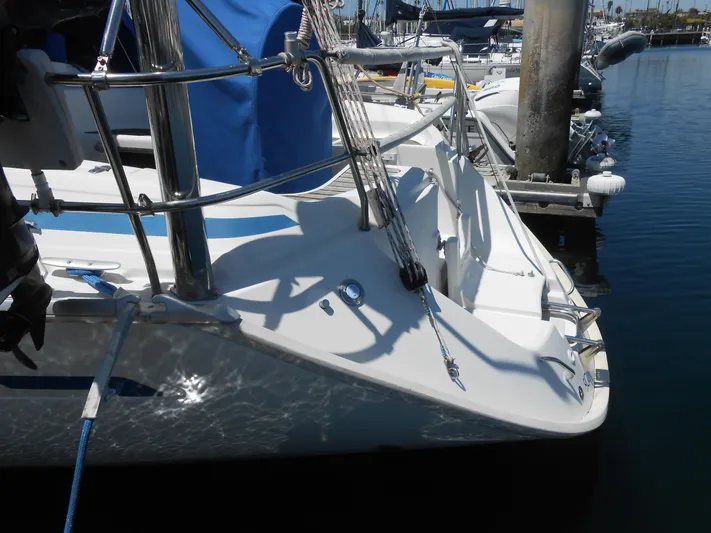 Pilitak Yacht Photos Pics Sailboat Bavaria 37 (2001) docked at marina, showing deck and railing details.