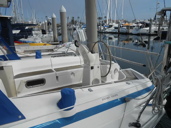 Pilitak Yacht Photos Pics Bavaria 37 sailboat, 2001 model, docked in a marina with other boats.
