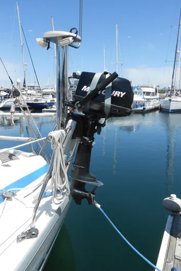 Pilitak Yacht Photos Pics Bavaria 37 sailboat with Mercury outboard motor, docked in a marina, 2001 model.