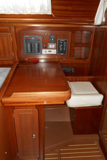 Pilitak Yacht Photos Pics Interior of a 2001 Bavaria 37 yacht with wooden navigation station and control panel.