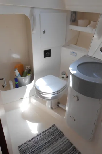 Pilitak Yacht Photos Pics Bathroom interior of a 2001 Bavaria 37 yacht, featuring a toilet and sink.