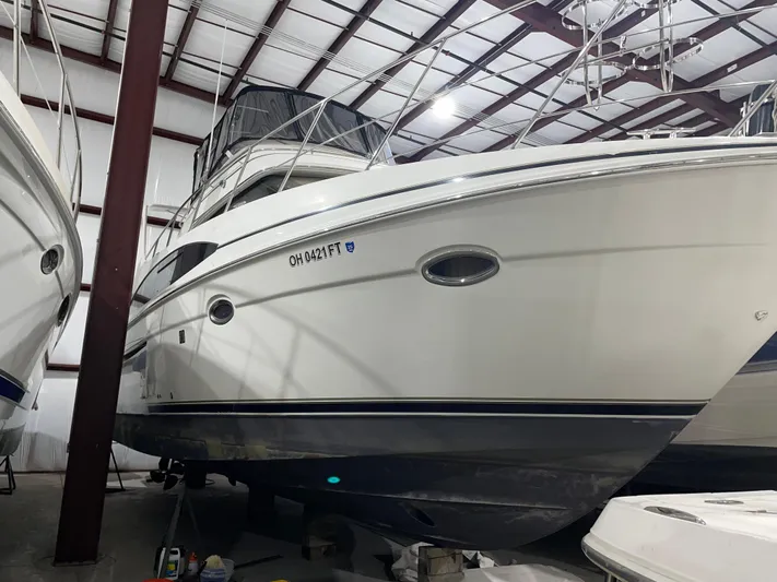  Yacht Photos Pics 2005 Carver 42 Mariner yacht stored indoors, showcasing sleek design and spacious cabin.