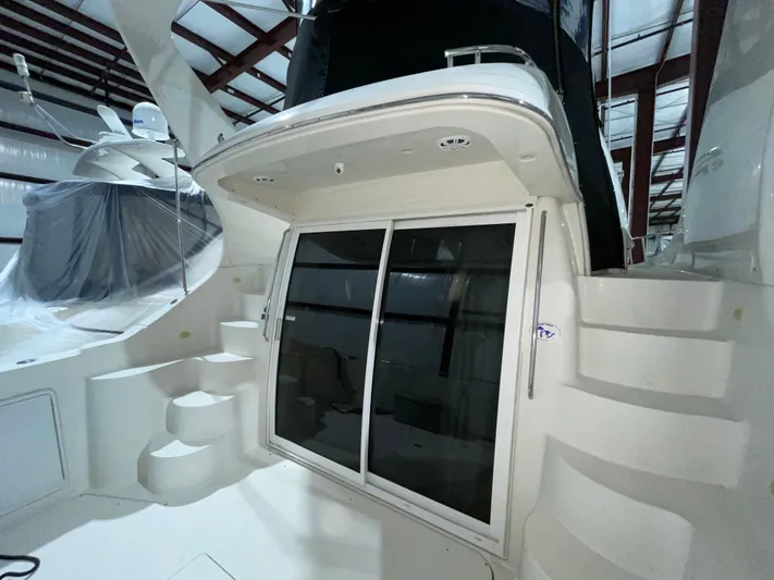  Yacht Photos Pics 2005 Carver 42 Mariner yacht interior with sliding glass doors and curved steps.