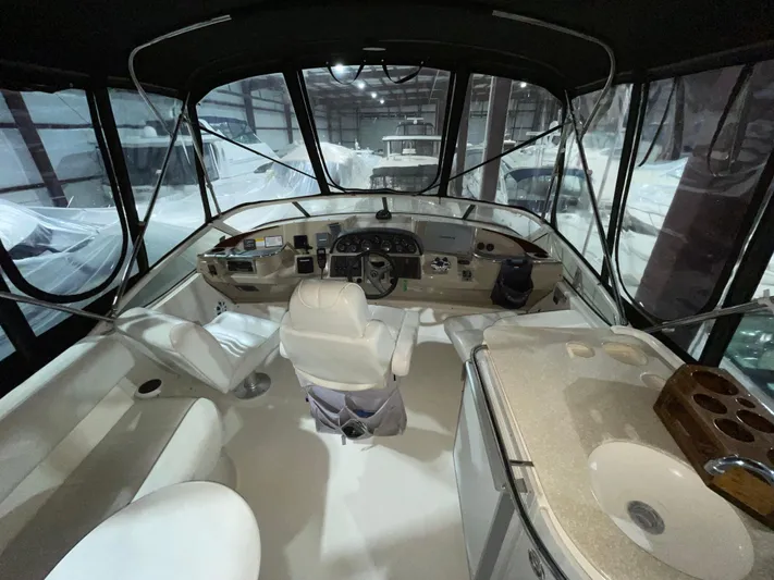  Yacht Photos Pics Interior view of 2005 Carver 42 Mariner yacht cockpit with helm and seating.