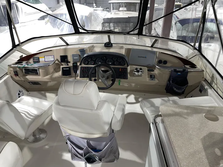  Yacht Photos Pics Interior helm of 2005 Carver 42 Mariner yacht with steering wheel and navigation equipment.