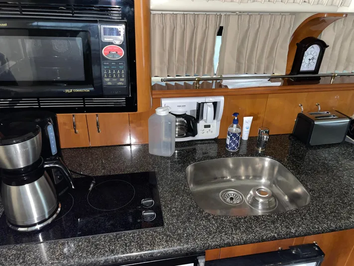  Yacht Photos Pics Kitchen area in a 2005 Carver 42 Mariner yacht with appliances and sink.