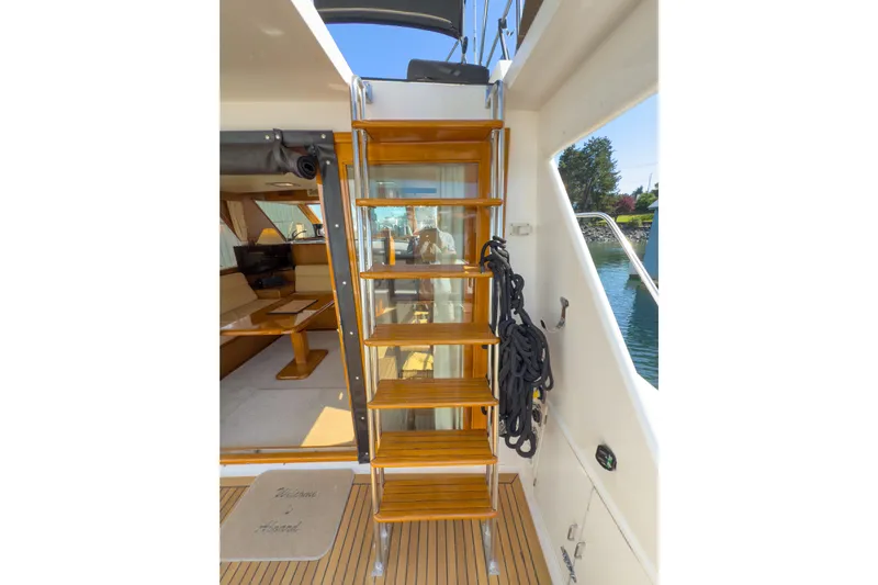 Silver Spring Yacht Photos Pics Staircase on 1985 Ocean Alexander 420 Sport Sedan yacht, leading to upper deck.