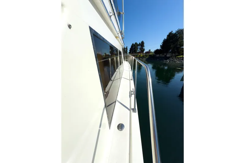 Silver Spring Yacht Photos Pics 1985 Ocean Alexander 420 Sport Sedan yacht side view on calm water.