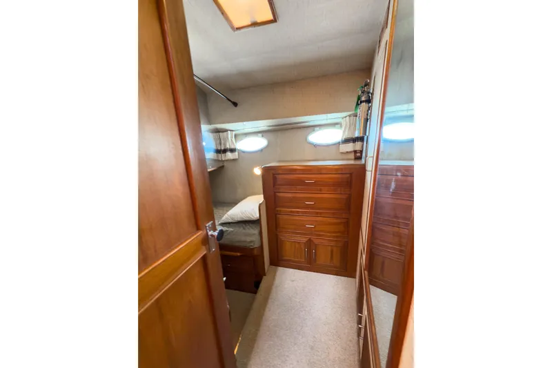 Silver Spring Yacht Photos Pics 1985 Ocean Alexander 420 Sport Sedan cabin with wooden drawers and bed.