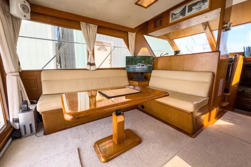 Silver Spring Yacht Photos Pics Interior of 1985 Ocean Alexander 420 Sport Sedan with elegant wood and beige seating.