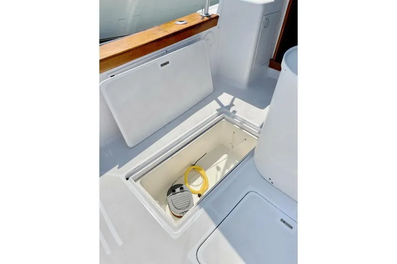 Aqua Ma'am Yacht Photos Pics Open storage compartment on 1986 Ocean 38 Super Sport boat deck.