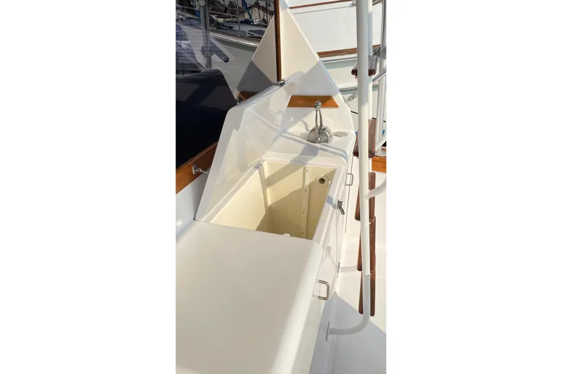 Aqua Ma'am Yacht Photos Pics 1986 Ocean 38 Super Sport boat interior with open storage compartment.