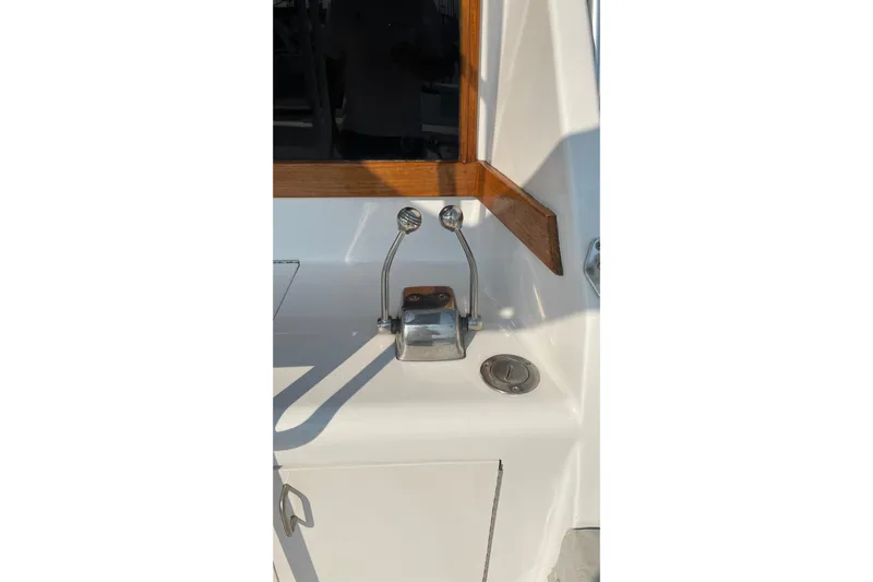 Aqua Ma'am Yacht Photos Pics 1986 Ocean 38 Super Sport boat control levers and panel in sunlight.