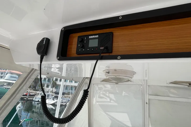 Aqua Ma'am Yacht Photos Pics Simrad marine radio on 1986 Ocean 38 Super Sport boat, docked at marina.