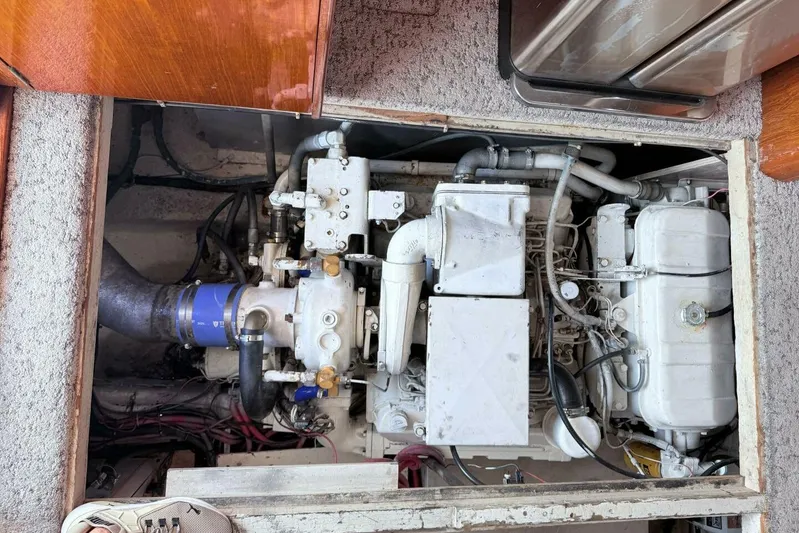 Aqua Ma'am Yacht Photos Pics Engine compartment of a 1986 Ocean 38 Super Sport boat, showcasing mechanical components.