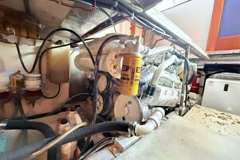 Aqua Ma'am Yacht Photos Pics Engine room of 1986 Ocean 38 Super Sport boat, featuring detailed mechanical components.