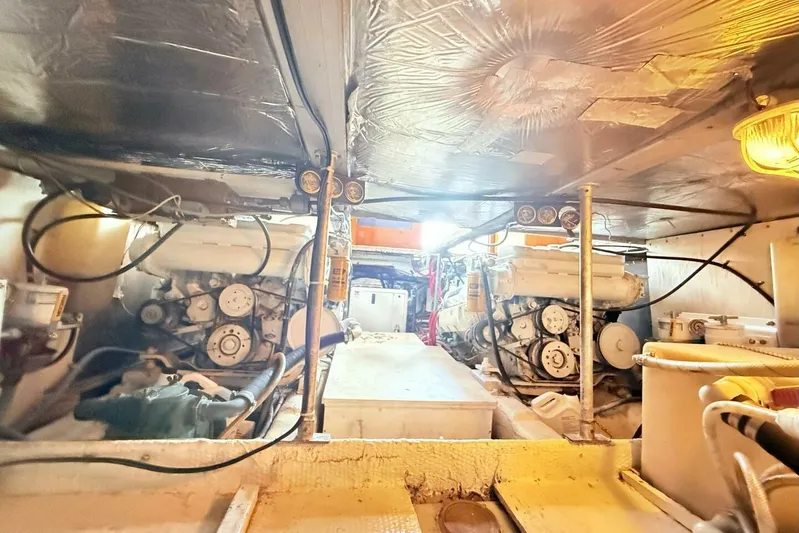 Aqua Ma'am Yacht Photos Pics Engine room of a 1986 Ocean 38 Super Sport boat, showcasing dual engines.