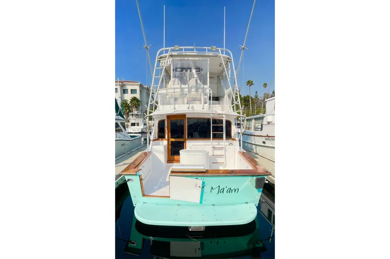 Aqua Ma'am Yacht Photos Pics 1986 Ocean 38 Super Sport yacht docked, featuring a spacious deck and elegant design.