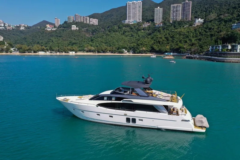  Yacht Photos Pics Luxurious 2017 Sanlorenzo SL78 yacht on serene turquoise waters near lush coastline.