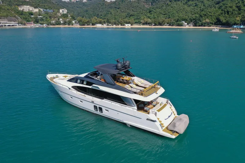  Yacht Photos Pics Sanlorenzo SL78 2017 yacht cruising in serene blue waters near a lush coastline.