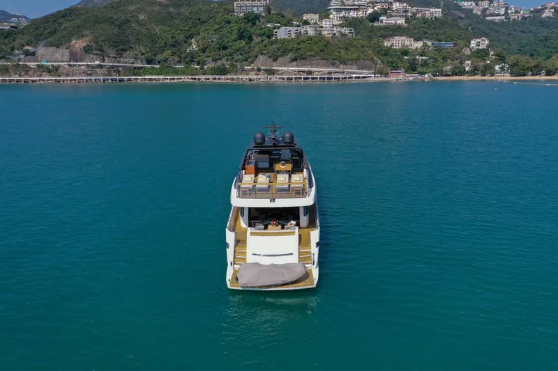  Yacht Photos Pics Sanlorenzo SL78 yacht from 2017 on serene blue waters near a lush coastline.