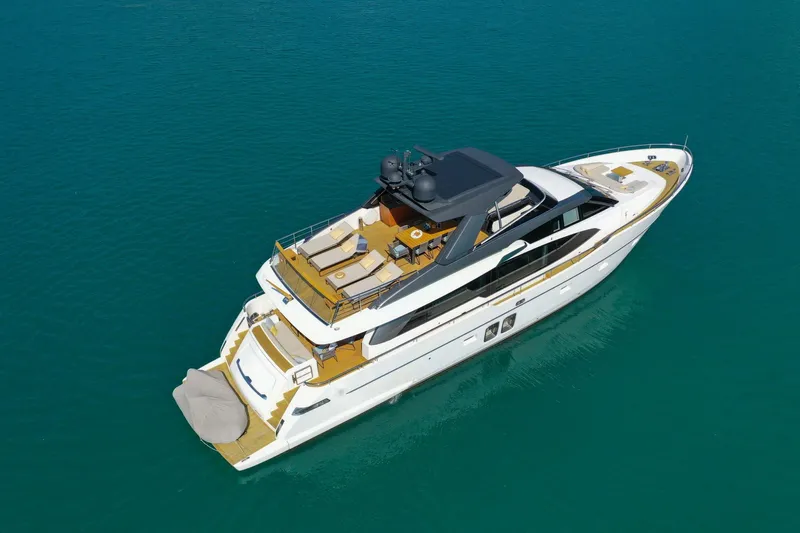  Yacht Photos Pics Luxury 2017 Sanlorenzo SL78 yacht cruising on clear blue water.