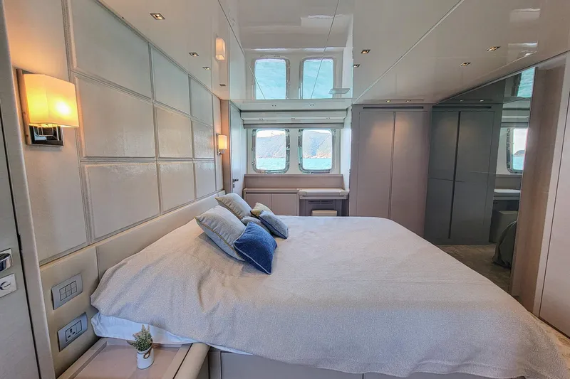  Yacht Photos Pics Luxurious bedroom interior of 2017 Sanlorenzo SL78 yacht with modern decor and large windows.