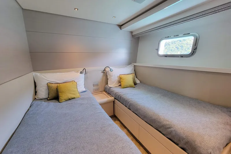  Yacht Photos Pics Twin cabin in 2017 Sanlorenzo SL78 yacht with modern decor and window view.