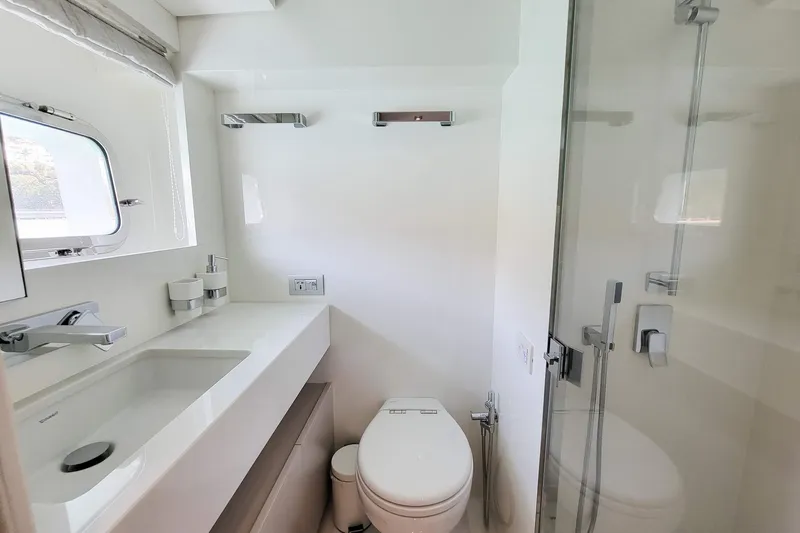  Yacht Photos Pics Modern bathroom on 2017 Sanlorenzo SL78 yacht with sleek fixtures and glass shower.