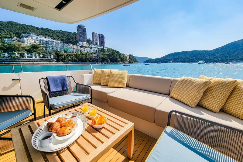  Yacht Photos Pics Luxurious Sanlorenzo SL78 yacht deck with breakfast, scenic coastal view, 2017 model.