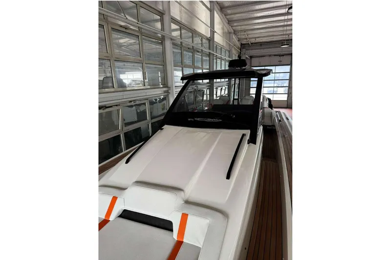  Yacht Photos Pics 2023 Technohull Omega 47 boat in a showroom, showcasing sleek design and modern features.