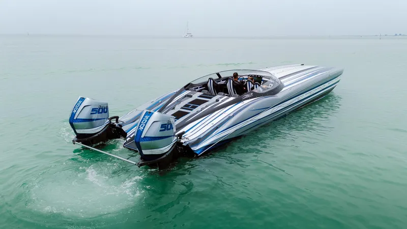  Yacht Photos Pics 2024 MTI 440X speedboat with dual 500 horsepower engines on calm water.
