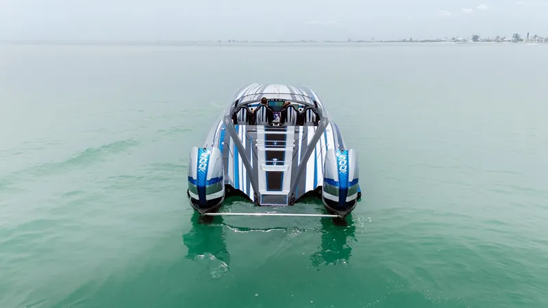  Yacht Photos Pics 2024 MTI 440X powerboat on calm water, showcasing sleek design and advanced engineering.