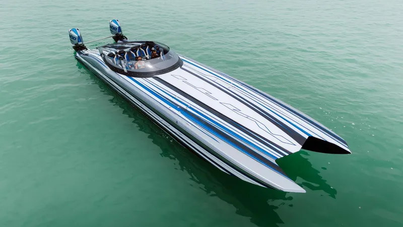  Yacht Photos Pics 2024 MTI 440X powerboat with sleek design and dual engines on calm water.
