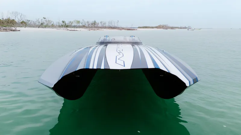  Yacht Photos Pics 2024 MTI 440X powerboat on calm water, showcasing sleek design and modern features.