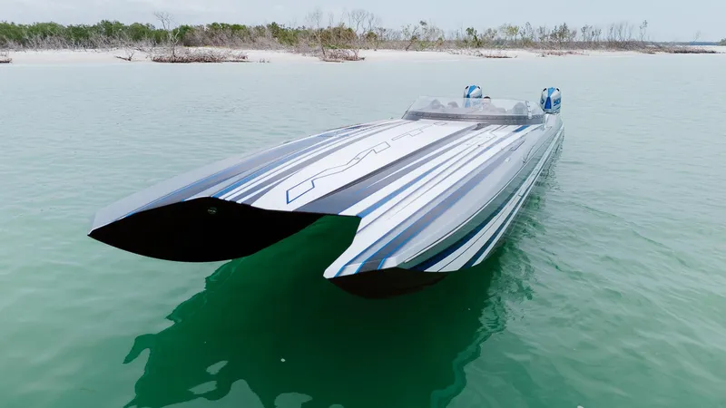  Yacht Photos Pics 2024 MTI 440X powerboat on calm water, showcasing sleek design and modern features.