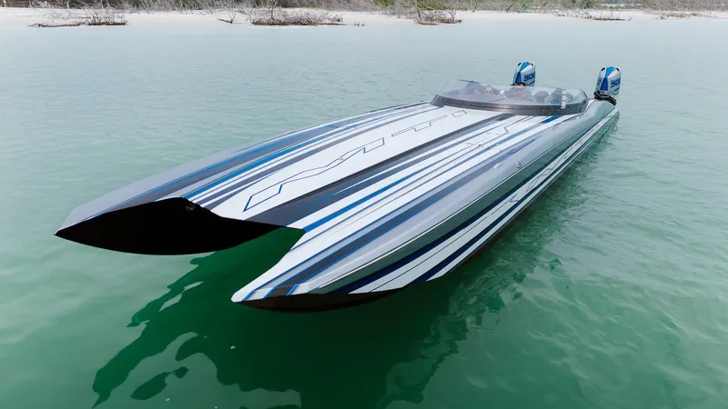  Yacht Photos Pics 2024 MTI 440X powerboat with sleek design on calm water.