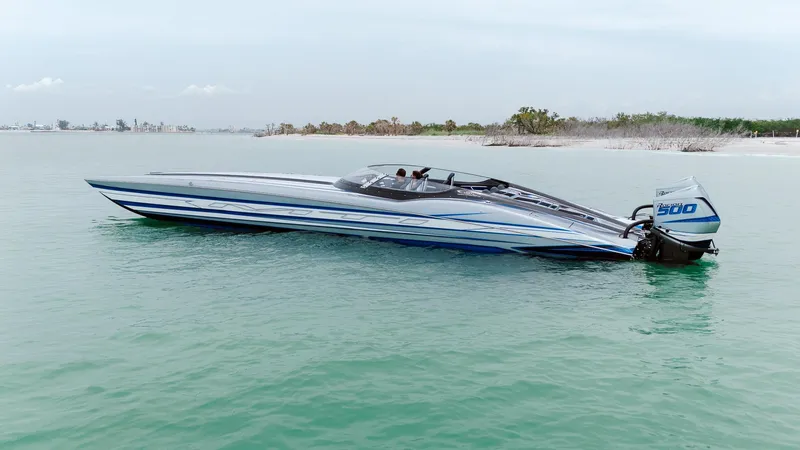  Yacht Photos Pics 2024 MTI 440X speedboat on calm water, featuring sleek design and powerful engine.