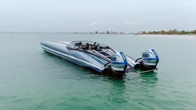  Yacht Photos Pics 2024 MTI 440X speedboat with dual outboard engines on calm water.