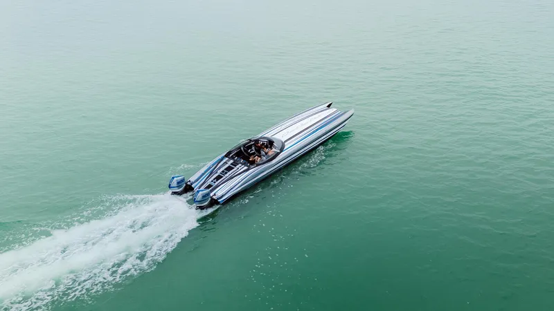  Yacht Photos Pics Aerial view of 2024 MTI 440X speedboat cruising on open water.