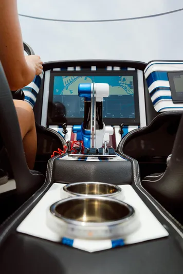  Yacht Photos Pics 2024 MTI 440X boat cockpit with advanced navigation system and dual cup holders.