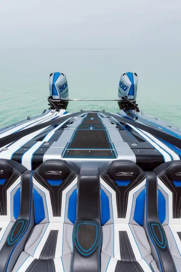  Yacht Photos Pics 2024 MTI 440X powerboat with sleek design and dual engines on calm water.